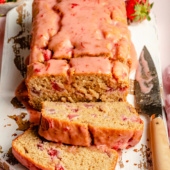 healthy strawberry bread sliced on a cutting board