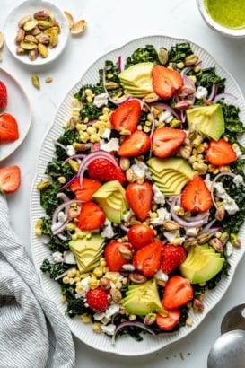 strawberry kale salad on a platter