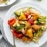 healthy sweet and sour chicken stir fry with broccoli and pineapple on a plate