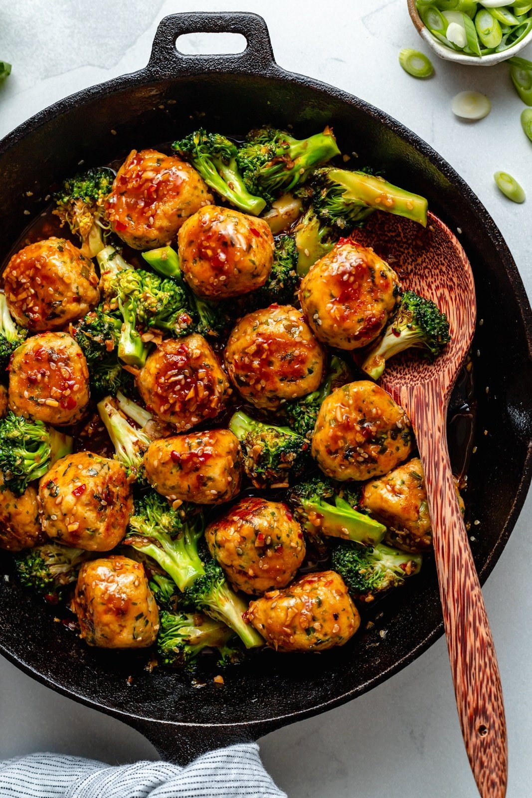 one pan sesame chicken meatballs and broccoli in a skillet