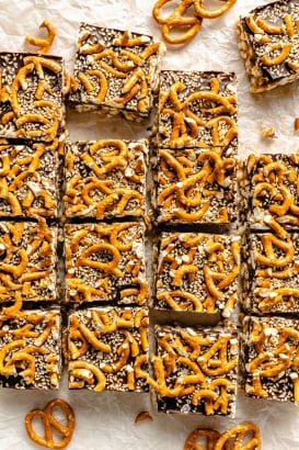 chocolate tahini rice krispie treats topped with pretzels