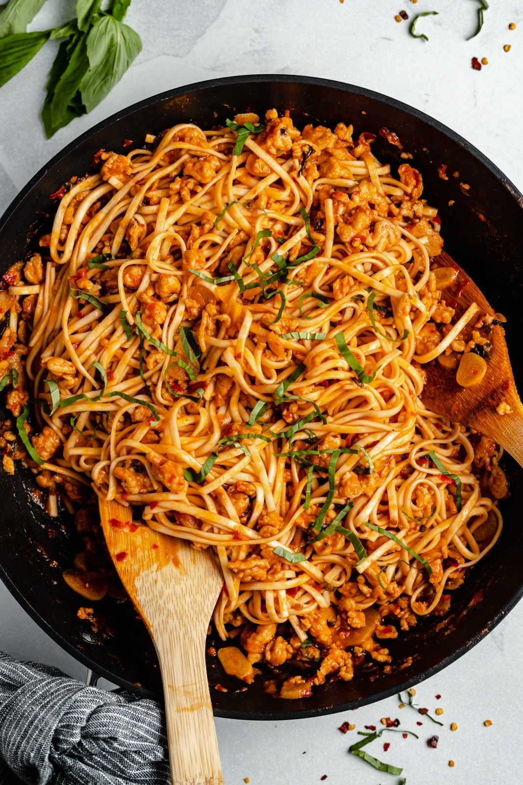 cooking hot chicken and ramen noodles in a pan