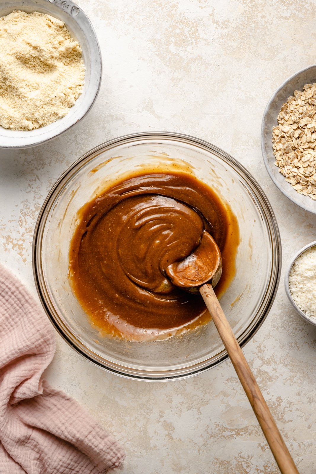 mixing wet ingredients for healthy monster cookie bars