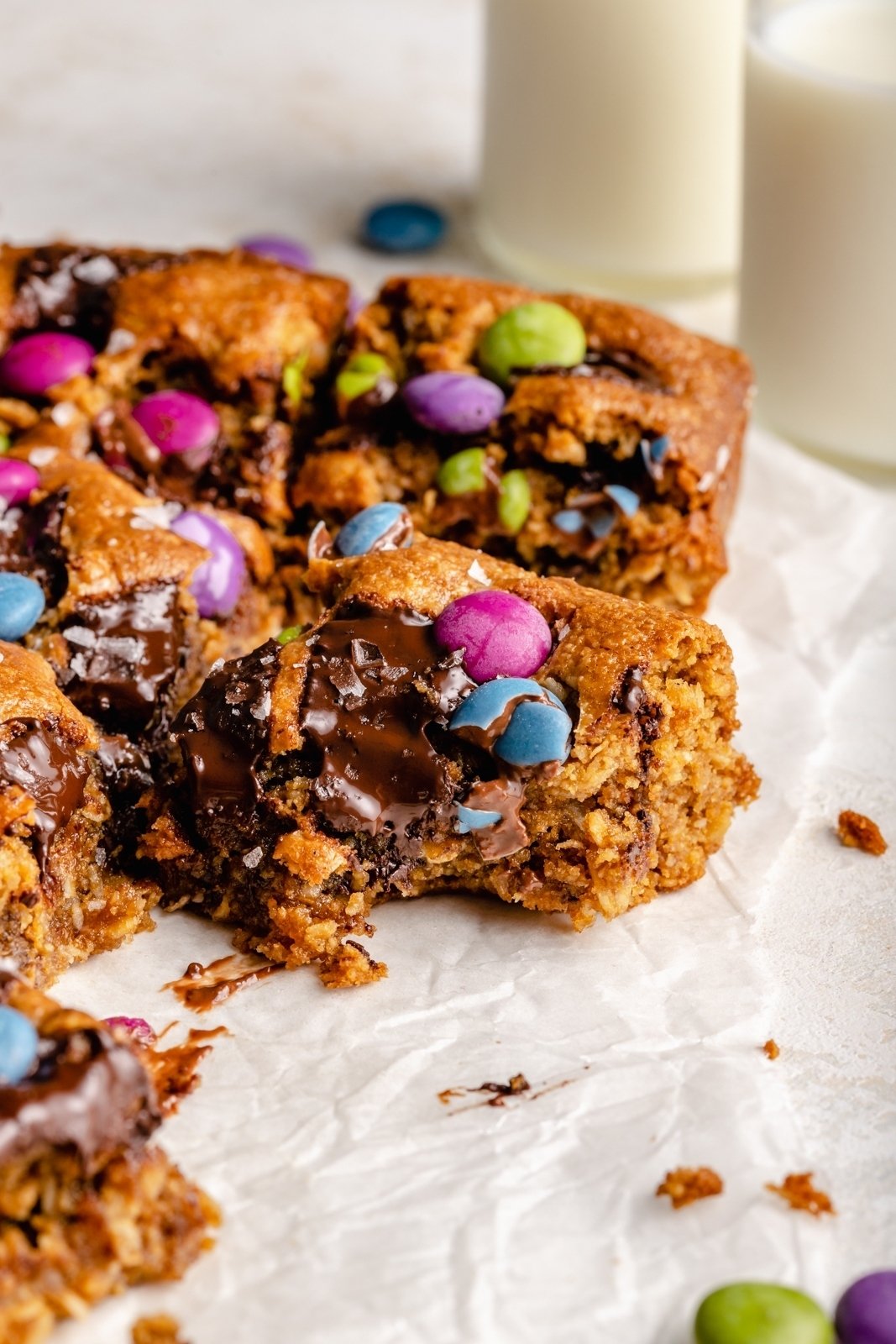 monster cookie bars on parchment paper