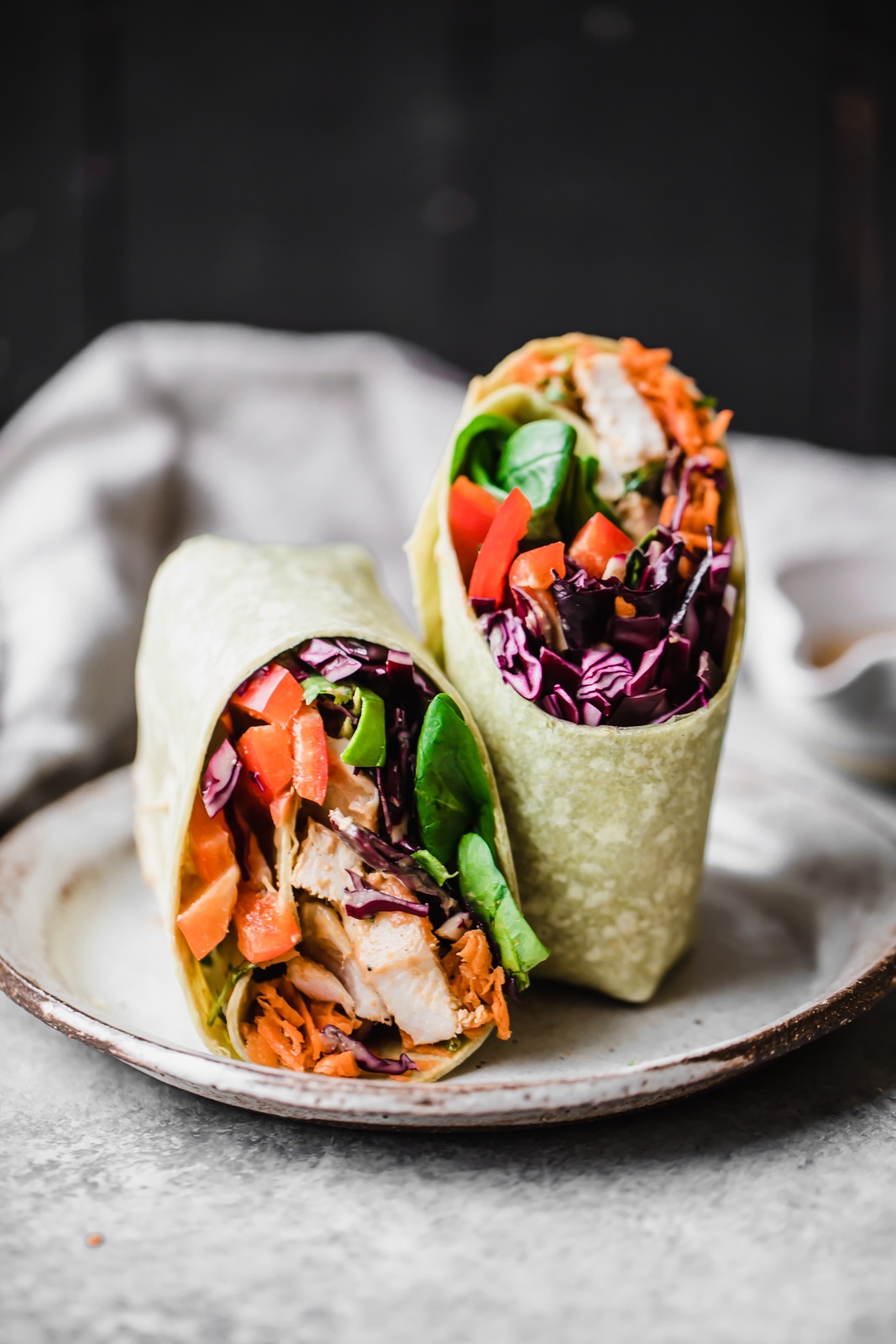 Thai peanut chicken wraps on a plate