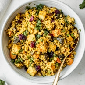 curried coconut brown rice with tofu in a bowl