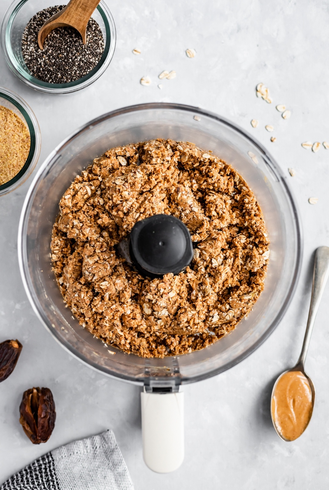 the base for vegan no bake chocolate peanut butter oatmeal bars in a food processor