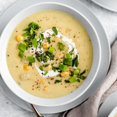 vegan corn chowder in a bowl with a spoon