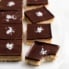 caramel millionaire bars on parchment paper