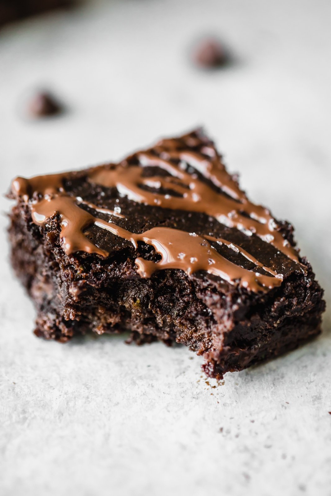 paleo zucchini brownie with a bite taken out