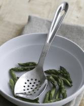 slotted spoon in a pan