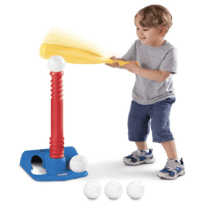 kid playing with a t-ball set