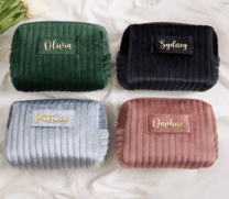 four makeup bags with names printed on them