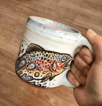 ceramic mug with trout painted on it