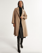 woman in a long tan coat