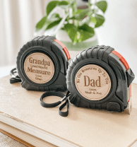 two personalized tape measures